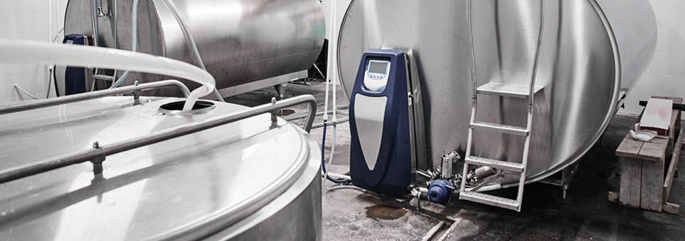 Automated cow farm, milk tanks. Milking machine, modern production technology at the factory