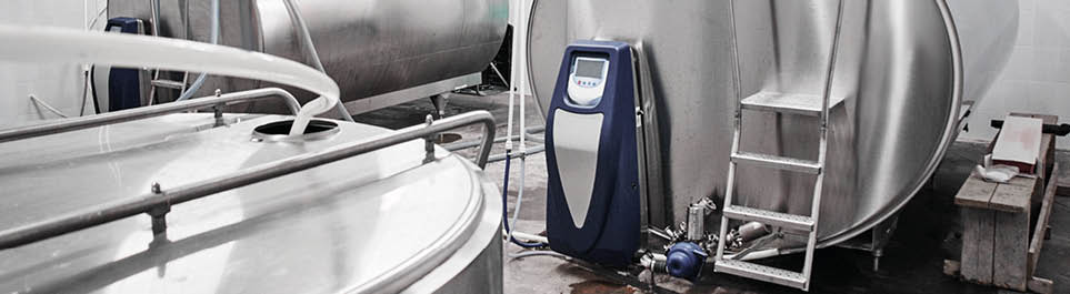 Automated cow farm, milk tanks. Milking machine, modern production technology at the factory